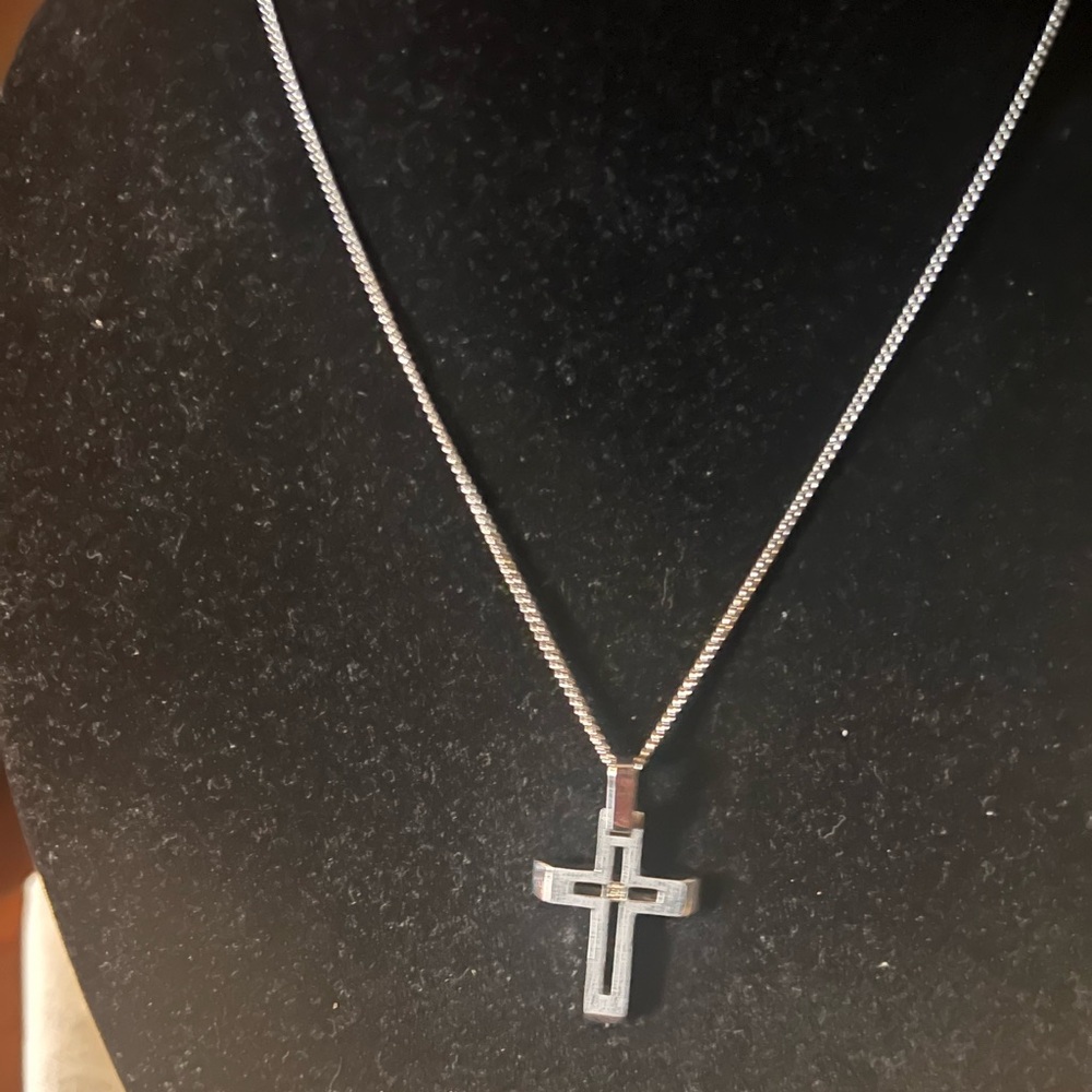 Beautiful Sterling Silver Necklace with a diamond in the middle of the Cross.